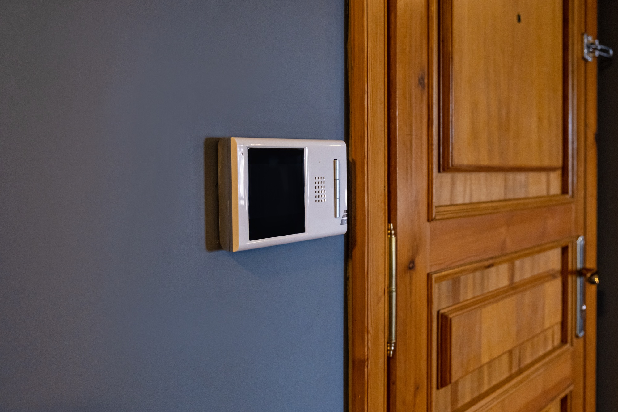 Video intercom display near the entrance door at home close up